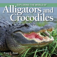 Omslagsbild: Exploring the world of alligators and crocodiles av 
